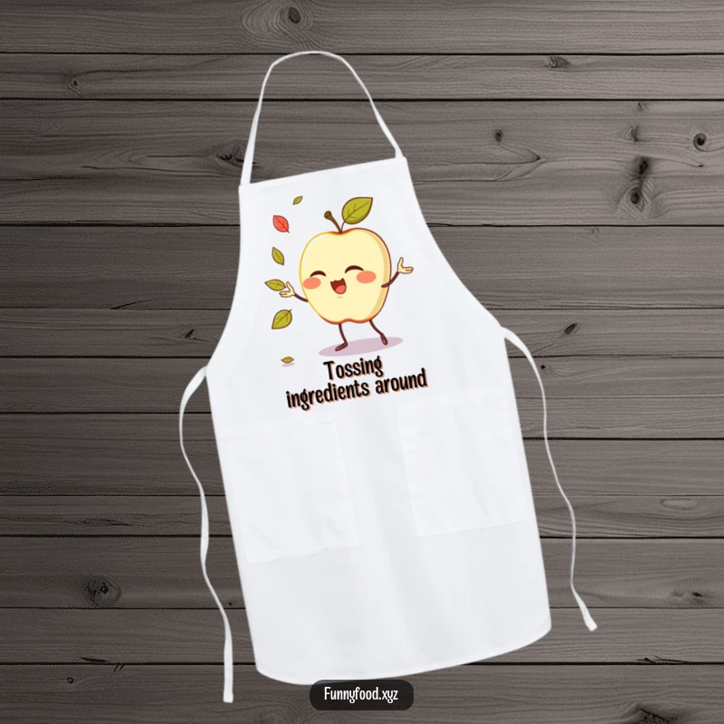 Funny apron featuring a winking anthropomorphic apple demonstrating its juggling prowess with leaves while cooking.