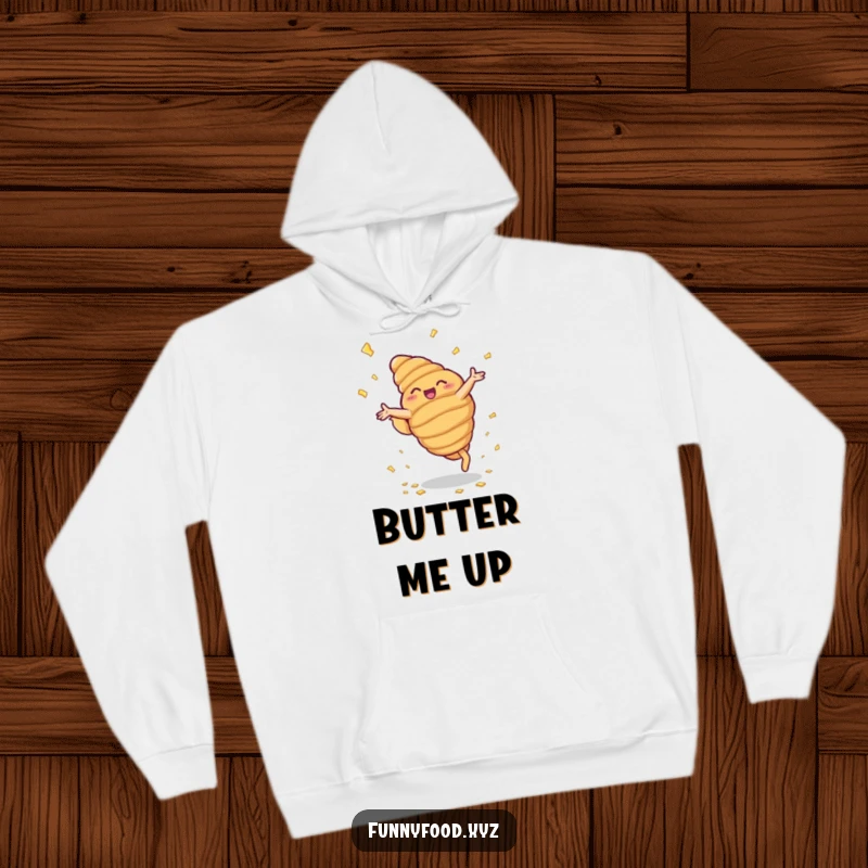 Funny hoodie depicting a beaming anthropomorphic croissant performing cartwheels with a shower of buttery flakes.