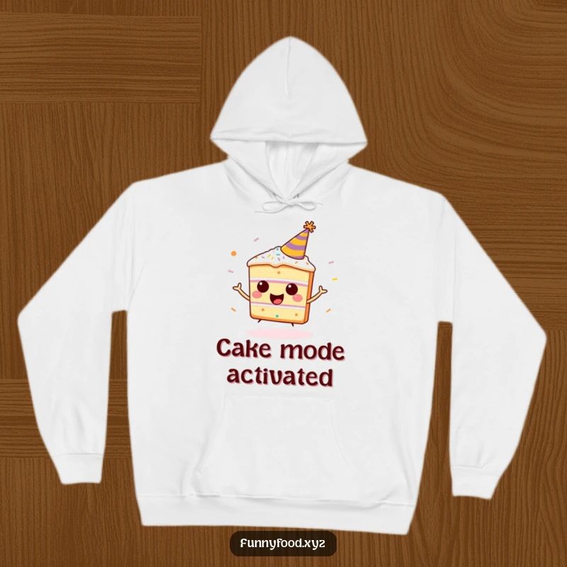 Funny happy cake slice hoodie, adorned with a party hat, bouncing joyfully with sprinkles, a humorous and cozy celebration piece.
