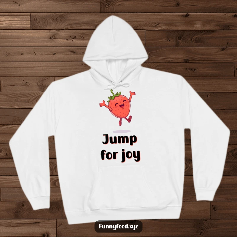 Funny hoodie depicting a gleeful anthropomorphic strawberry in mid-air during a joyful, playful leap.