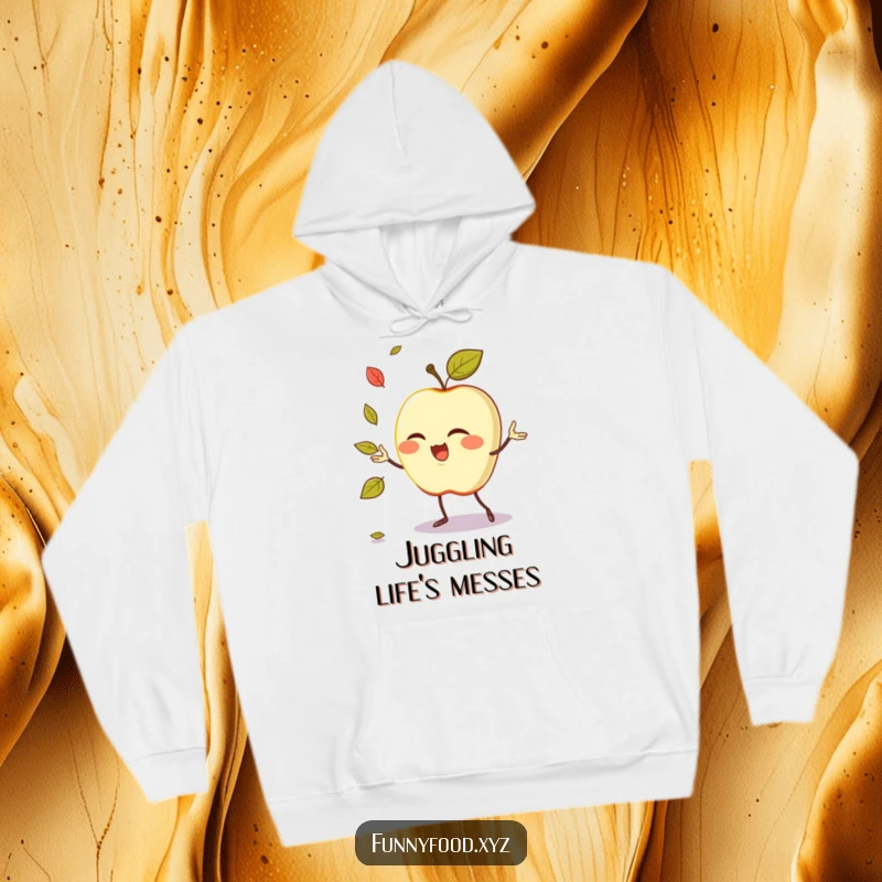 Funny juggling apple hoodie depicting a winking anthropomorphic apple performing a comical leaf juggling act.